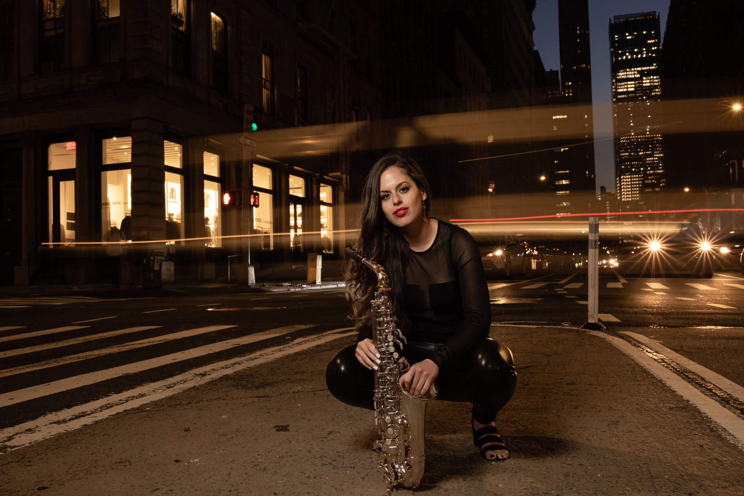 Alexa in the street in NYC with her saxophone. Photo by Anna Yatskevich.