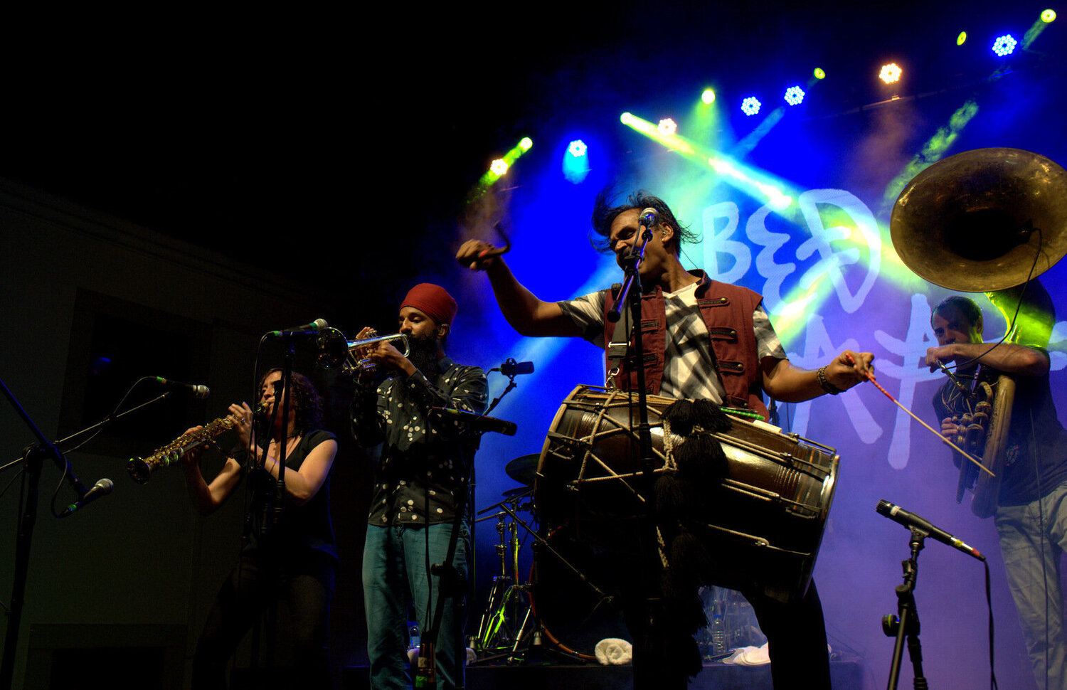 Sunny Jain with a drum on stage