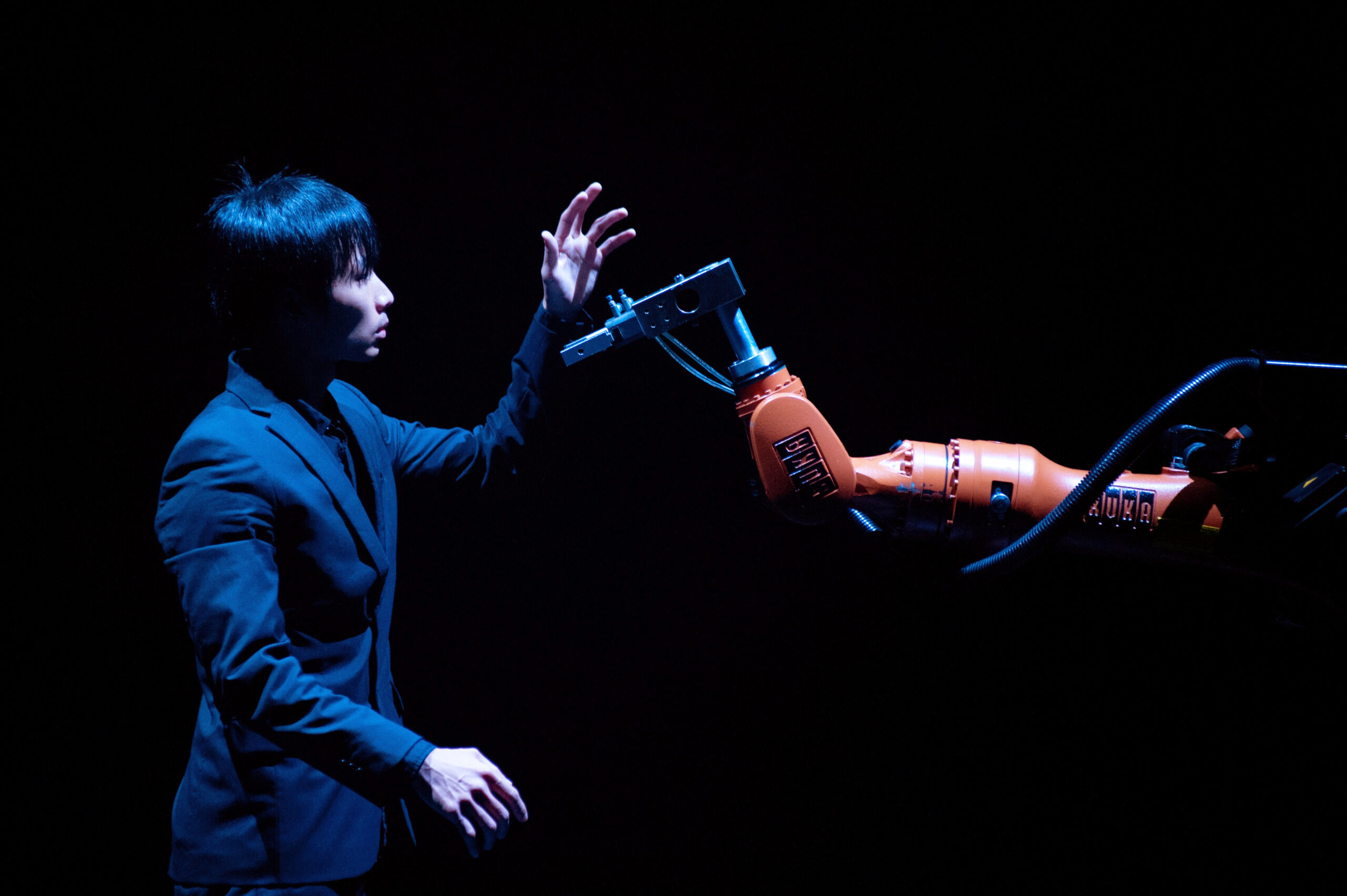 Huang Yi with his robot on stage