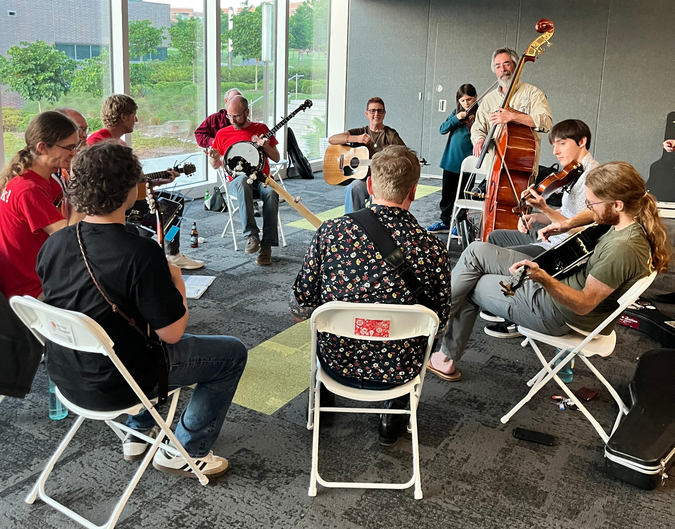 Hank Smith and community members during a music jam session. Photo by Liza Green.